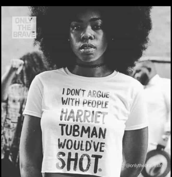 picture of a Black woman wearing a tee shirt that says "I don't argue with people Harriet Tubman would've shot"